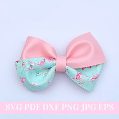 a pink and blue flowered bow on top of a white background with the words svg pdd dxf png jpc