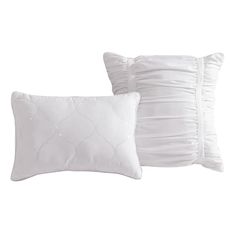 two white pillows with ruffles on the side and one pillow in the back