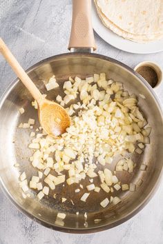 the food is being cooked in the pan