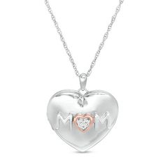 Celebrate your mom with this darling heart locket. Fashioned in sterling silver and 10K rose gold, this silver heart-shaped choice showcases the word "mom" sculpted in an uppercase print font. The heart-shaped rose gold "O" shimmers with diamond accents at the center. Completing the design, this hinged look opens to reveal space for a small memento and an open-worked filigree heart motif on the back. Buffed to a brilliant luster, this locket suspends along an 18.0-inch rope chain that secures wi Diamond Locket, Filigree Heart, Heart Motif, Jewelry Lockets, Peoples Jewellers, Keepsake Jewelry, Heart Locket, Rope Chain, Diamond Stone