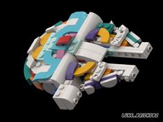 an image of a lego space ship made out of different colors and shapes on a black background