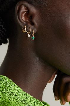 Octavia Elizabeth's 'Charmed' earrings are part of the 'Nesting Gem' collection - 0.50-carats of faceted emerald hang from a 'Micro' version of the label's 'Gabby' hoops. They're handmade from 18-karat recycled gold and finished using its signature hammering technique. They look just as great worn solo as they do stacked with coordinating styles.<br><br>This product was Locally Made and Reduces Waste. Find out more about NET SUSTAIN <a … Elizabeth Jewelry, Gold Diamond Hoop Earrings, Crystal Hoop Earrings, Earrings In Gold, Sustainable Jewelry, Diamond Hoop Earrings, Emerald Jewelry, Recycled Gold, Gold Charm