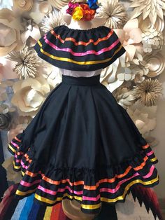 1 Mexican Dress PLEASE CHECK MEASUREMENTS WITH YOUR CHILD Ribbon on dress might be different Ask for different sizes and colors - kids Blouse Arm pit to arm pit 15 inches Waist 16 long 16.5 inches Skirt Long 20 inches long. Important the colors of the ribbon can change Undergarment and accesories not included VISIT OUR WEBSITE FOR TRADITIONAL HAND MADE CLOTHING www.mexicotodocorazon.com 50 cm Infant DESING MAY VARY... HAND SEWN NO TWO DESIGNS ARE THE SAME Note: All color embroidery is slightly d Mexican Dresses For Kids, Ribbon On Dress, Mexican Fancy Dress, Mexican Traditional Clothing, Folklorico Dresses, Kids Blouse, Mexican Dress, Color Embroidery, 5 De Mayo