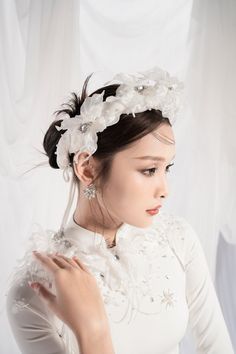 A beautiful traditional dress is always the desire of every girl. Sophisticated and meticulous embellishments, crystals, and pearls together with flowers are very sharp, making the Ao Dai always the center of attention. It is a perfect choice for the big occasion. Note:*Processing time takes 11-14 working days (including 8-10 working days for manufacturing and NOT including shipping time)**Backorder Definition- The product is low in stock and in case the customer purchased successfully after out Pearl White Pearl Bridal Accessories, Elegant Adjustable Bridal Accessories For Bridal Shower, Elegant Adjustable Bridal Accessories, Elegant White Adjustable Headband, Elegant Handmade Flower Hair Accessories For Formal Events, Elegant Handmade Flower Hair Accessories For Formal Occasions, Elegant Adjustable Hair Accessories For Ceremony, Elegant Adjustable White Headband, Elegant Bridal Accessories For Bridal Shower