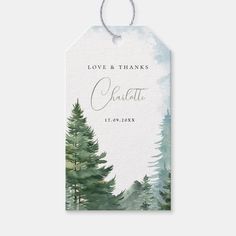 a watercolor pine tree wedding gift tag with the words love and thanks written on it