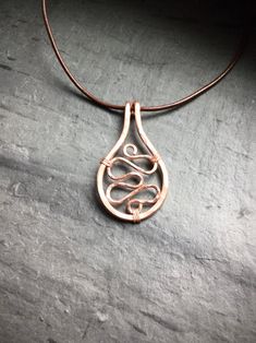 This hammered copper necklace with a unique wire wrapped design makes the perfect boho chic statement necklace. This also makes a great gift for a friend who loves cool and eye catching jewelry. The Bohemian yet polished style would look great accessorizing your beach outfits as well. Click through to view this and more! #handmadejewelry #copperjewelry #wirewrappedjewelry Copper Wire Teardrop Pendant Jewelry For Gift, Copper Wire Teardrop Pendant Jewelry Gift, Everyday Bohemian Copper Jewelry, Rose Gold Copper Wire Necklace For Gift, Rose Gold Copper Wire Necklace Gift, Hand Forged Copper Necklace In Rose Gold, Hand Forged Rose Gold Copper Necklace, Spiritual Rose Gold Copper Necklace, Copper Teardrop Pendant Necklace For Jewelry Making