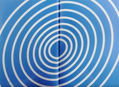 an image of a blue and white background with circles in the center, as seen from above