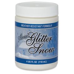 a jar of gluer snow sitting on top of a white table