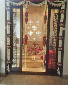 an open door decorated with flowers and garlands for diwaling on the occasion