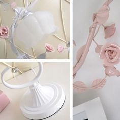 pink roses are hanging on the wall next to white vases and other items in front of them