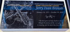 a glass plaque with a guitar on it's side and the words jerry jean brown