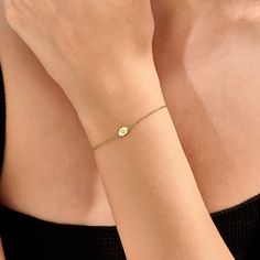 Adorn your wrist with the Diamond Solitaire Star Bracelet, crafted in 14k Solid Gold. This delicate bracelet features a tiny single diamond set in a small oval design, perfect for stacking. A handmade piece of elegance for women. 𝐈𝐭𝐞𝐦 𝐃𝐞𝐭𝐚𝐢𝐥𝐬 * Gold KT: 14KT  * Custom Gold Color: Yellow Gold  * Chain Width 5 mm x 9 mm 𝐆𝐞𝐦𝐬𝐭𝐨𝐧𝐞 𝐃𝐞𝐭𝐚𝐢𝐥𝐬  * Gemstone Ctw: 0.01 Ctw  ▶ Want to find out more 𝐛𝐫𝐚𝐜𝐞𝐥𝐞𝐭𝐬? https://etsy.me/3wt3nc6 ▶ Want to find out more? See our storefron Oval Rose Gold Bracelet As Gift, Oval Rose Gold Bracelet For Gift, Rose Gold Oval Bracelet Gift, Oval Gold Diamond Bracelet As Gift, Oval Gold Diamond Bracelet For Gift, Adjustable Oval 14k Gold Bracelet, Adjustable Oval Dainty Bracelets, Dainty Oval Adjustable Bracelets, Dainty Gold Oval Bracelets