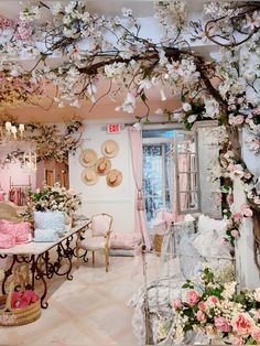 a room filled with lots of furniture and flowers