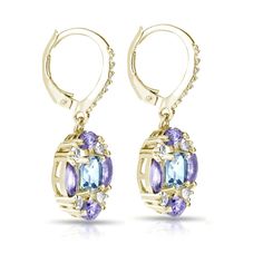 These luxurious leverback dangle earrings feature a blue topaz center stone surrounded by amethyst and white topaz gemstones. The earrings are crafted of yellow gold flashed sterling silver. Product Details Metal Type yellow-gold-flashed-silver Metal Stamp 925-sterling Weight 4.7GR Length 31MM Width 14MM Back Finding lever-back Stone Details Gem Type blue-topaz Number of Stones 2 Stone Shape cushion-cut Total Weight 1.96 Setting Type prongs Stone Creation Method natural Stone Treatment Method He Leverback Earrings, Topaz Gemstone, Silver Blue, White Topaz, Cushion Cut, Metal Stamping, Blue Topaz, Types Of Metal, Natural Stone