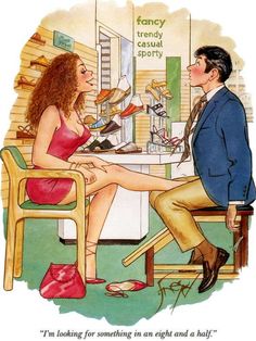 a woman sitting in a chair talking to a man who is looking at her shoes