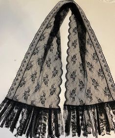 **Long black lace Scarf **THIS BEAUTIFUL  SCARF IS HANDMADE BY ME "Mary Anne Lagana". It is made of excellent quality black lace that flows nicely.  The scarf is fringed with various lace trims.  It measures 84" long  and is 13" wide. Hand wash, line dry.  Great with jackets, tee shirts or dressing up or down....                       SEE MY OTHER SCARVESANIMAL PRINTS, EMBROIDERED, CHIFFON, tropical prints, stripes, FLORALS, HOUNDSTOOTH CHECKS, Dots, abstracts, CRINKLE CHECKS Beautiful Scarf, Tropical Prints, Embroidered Chiffon, Lace Scarf, Lace Trims, Long Black, Tropical Print, Scarf Wrap, Black Lace