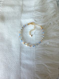 FOR OTHER DAINTY BEADED BRACELETS: https://www.etsy.com/ca/shop/ArtiChouXCanada?ref=seller-platform-mcnav§ion_id=46088511 Bracelet Length: 13-18cm (5.1-7 inches) with a 14k gold filled extender. But if you require a different size or prefer a personalized touch, please don't hesitate to get in touch. This bracelet features an assortment of summer themed pastel colors: blue, white , orange, cream, and 18k gold filled seed beads. It also contains a freshwater pearl.  Thread may be visible since it is a handmade product   SIZING  Wrap a soft measuring tape snugly around the widest part of your wrist. Add 1.27cm (0.5in) to that measurement to determine the right bracelet size.  MATERIALS  - Japanese MGB glass seed beads(2x4mm) - 18K gold filled beads of 2mm - Freshwater pearl - 14K gold filled Obx Summer, Adjustable Beaded Bracelet, Preppy Bracelets, Seed Bead Bracelet, Beads Bracelet Design, Beaded Jewelry Designs, Bracelet Dainty, Freshwater Pearl Bracelet, Summer Bracelets