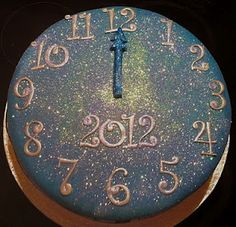 a blue cake with numbers and a cross on it