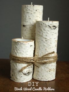 three birch wood candle holders tied with twine