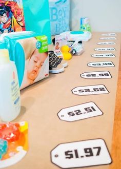 baby products are lined up on a table with labels for each product and the price