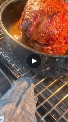 a roasting pan filled with meat on top of an oven