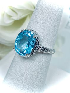 Turquoise Sapphire Gemstone Ring For Anniversary, Classic Wedding Gemstones With Diamond Cut, Turquoise Sapphire Ring For Anniversary, Luxury Blue Topaz Cushion Cut Ring, Turquoise Blue Topaz Rings Fine Jewelry, Elegant Blue Topaz Gemstone With Center Stone, Fine Jewelry Turquoise Sapphire Ring With Accent Stones, Turquoise Sapphire Ring With Accent Stones, Elegant Cushion Cut Topaz Ring With Accent Stones