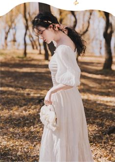 Contemplate the Ending of Summer in this beautiful white Light Academia Dress from Deer Doll featuring voluminous balloon sleeves allowing an off-the-shoulders look, faux buttons through front, tiered layers and intricately romantic fabric embroidery. Elegant Peasant Dress With Gathered Sleeves For Spring, Elegant Spring Peasant Dress With Gathered Sleeves, White Dress With Blouson Lantern Sleeves, Elegant Spring Peasant Dress With Puff Sleeves, Spring Wedding Dress With Puff Balloon Sleeves, Elegant Off-shoulder Puff Sleeve Dress For Garden Party, Feminine White Puff Sleeve Dress, White Puff Sleeve Dress With Gathered Billowy Sleeves, White Billowy Puff Sleeve Dress With Gathered Sleeves