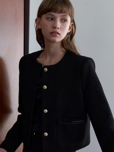 This product is a stitch pocket round neck tweed jacket that exudes classic sophistication with a modern twist. The jacket's round neck and structured fit provide a sleek outline, while the golden button details add a touch of luxury. The unique stitch pocket not only enhances functionality but also serves as a subtle style statement, making this jacket an elegant choice for professional and social settings alike. - The jacket's round neckline offers a clean and elegant frame, perfect for showcasing statement jewelry.- Golden buttons down the front bring a refined and polished finish to the tweed fabric.- A uniquely designed stitch pocket adds a practical element without compromising the jacket's streamlined aesthetic.- Crafted from tweed, this jacket presents a timeless texture that' Classic Tweed Jacket With Hidden Button Closure, Chic Wool Tweed Jacket With Hidden Button Closure, Chic Black Tweed Jacket With Pockets, Wool Button-up Tweed Jacket With Pockets, String Balloons, Tailored Tweed Button-up Jacket With Hidden Closure, Elegant Frame, Tweed Fabric, Tweed Jacket