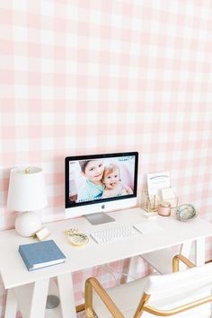 a desktop computer sitting on top of a white desk