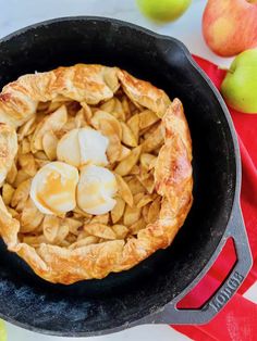 an apple pie in a cast iron skillet