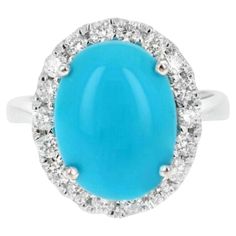 7.65 Carats Impressive Natural Turquoise and Diamond 14K White Gold Ring Suggested Replacement Value $5,600.00 Total Natural Oval Turquoise Weight is: Approx. 7.00 Carats Turquoise Measures: 12.00 x 10.00mm Natural Round Diamonds Weight: Approx. 0.65 Carats (color G-H / Clarity SI1-SI2) Ring size: 6.5 (free re-sizing available) Ring total weight: 5.5 grams Disclaimer: all weights, measurements and colors are approximate and may vary slightly from the listed dimensions or as seen in the image. Al Emerald Cut Rings, Gold Cocktail Ring, Gold Cocktail, Turquoise Rings, 14k White Gold Ring, Coral Turquoise, White Gold Ring, Natural Turquoise, Quality Diamonds