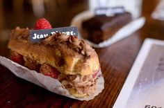 a piece of cake sitting on top of a wooden table