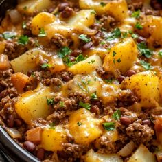 a casserole dish with potatoes and ground beef