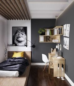 a bedroom with wood floors and gray walls