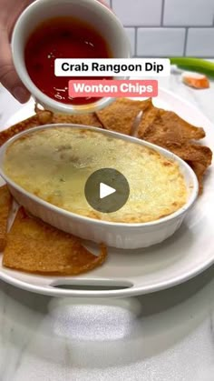 a white plate topped with chips and dip