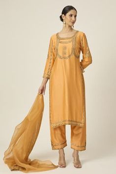 Amber yellow kurta with floral sequin, cutdana and bead embroidery. Paired with an embroidered pant and dupatta with embroidered border. - Aza Fashions Fitted Slub Silk Dupatta With Mirror Work, Fitted Slub Silk Salwar Kameez With Mirror Work, Fitted Cotton Silk Palazzo Set With Gota Work, Fitted Embroidered Tissue Silk Palazzo Set, Fitted Slub Silk Sets With Embroidery, Fitted Unstitched Tissue Silk Suit, Fitted Slub Silk Sets With Dabka Work, Fitted Tissue Silk Sets With Gota Work, Fitted Tissue Silk Palazzo Set For Diwali