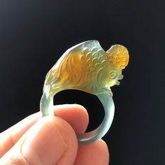 Natural Xiu Jade Serpentine Hand Carved Goldfish Ring | 16.2mm (US 5.5-6) | Icy Greenish Blue and Orange | Crystal Stone Gemstone Ring | GP 76 📏Size 👉Inner diameter: 16.2mm(US 5.5-6), Width: 4.4mm, Thickness: 2.8mm 🌺 💍This ring has been exquisitely hand-carved and polished into a cute and adorable goldfish, in beautiful icy greenish blue and orange colour. 💎 It is composed of Xiu Jade (serpentine), one of the four most famous ancient jades in China, this stone has a Mohs hardness of 3 to 5. Carved Jade Rings As A Gift, Collectible Jade Gemstone Rings, Carved Green Jade Rings, Blue Hand-strung Jade Jewelry, Artisan Carved Jade Jewelry, Raw Stone Ring, Carved Jade, Orange Colour, Orange Crystals