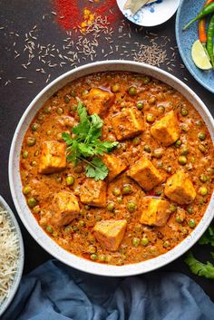 a white bowl filled with tofu and peas