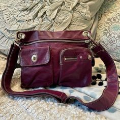 Roots Villager Leather Bag Purse Crossbody Purple Great pre loved condition  Adjustable strap  Beautiful soft leather  Tags: classic, leather, everyday, casual, fall Roots Villager Leather Bag Purse Crossbody Purple Violet Dress, Leather Tags, Sling Bags, Purse Crossbody, Gorgeous Bags, Classic Leather, Jacket Buttons, Cotton Sweater, Casual Fall