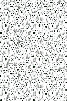 a black and white pattern with many faces