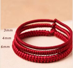 price for one bracelet. Material: handmade strands Color: Red/Dark red Wrist size: Please choose your wrist size thickness (diameter): 3mm/4mm/6mm Quantity : 1 pc  How to properly measure your wrist size: We want to make sure this bracelet fits you correctly. Measuring around your wrist is different than measuring a bracelet from end to end lengthwise. We go by the inside circle circumference of the bracelet, and not by how long the bracelet is. Here are the measuring instructions: 1. Wrap a thi Affordable Red Braided Bracelet With Adjustable Cord, Handmade Red Braided Bracelets With Nylon Cord, Handmade Red Braided Nylon Cord Bracelets, Handmade Red Nylon Cord Braided Bracelets, Red Hand Wrapped Braided Bracelets For Gift, Adjustable Braided Red Jewelry, Red Braided Jewelry As A Gift, Red Braided Jewelry For Gifts, Red Braided Jewelry Perfect As A Gift