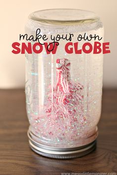 a mason jar filled with snow globes on top of a wooden table and the words make your own snow globe