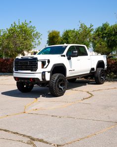 a white truck parked in a parking lot