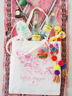 the contents of a bag are laid out on a tablecloth with other items in it