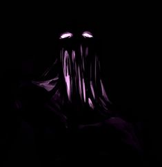 a creepy looking creature in the dark with its mouth open and eyes wide open, it appears to be glowing purple