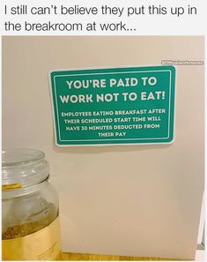 there is a sign on the wall that says you're paid to work not to eat