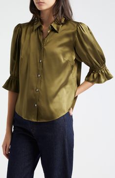 Elbow-length sleeves with ruffle cuffs frame this lustrous silk button-up cut in a relaxed fit with a sharp point collar. 22 1/2" length ( size Medium) Front button closure Point collar Elbow-length sleeves with ruffle cuffs Curved hem 100% silk Dry clean Imported Luxury Ruffled Blouse For Work, Luxury Ruffles Blouse For Work, Elegant Collared Blouse With Gathered Sleeves, Chic Blouse With Button Closure And Ruffle Sleeves, Elegant Blouse With Pleated Ruffle Sleeves, Elegant Blouse With Smocked Cuffs And Ruffle Sleeves, Elegant Tops With Smocked Cuffs And Ruffle Sleeves, Elegant Button-up Top With Gathered Sleeves, Elegant Button-up Blouse With Smocked Cuffs