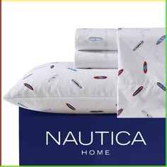 the nautica home bedding set is in white and blue