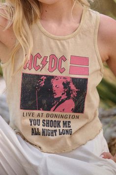 Mineral washed graphic tank top. Vintage-style AC/DC graphic print with "Live At Donington, You Shook Me All Night Long" text and Ace Young photo. Crew neckline. Sleeveless. Curved hem with lettuce-edge detailing. Racerback. Cropped length. Relaxed fit. 100% Cotton. Imported top designed and printed in LA. Officially licensed AC/DC merchandise. Model wears size S. Shook Me All Night Long, Long Text, Top Vintage, California State, Iron Decor, Ac Dc, Graphic Tank, Lettuce, Graphic Tank Top