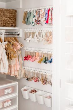 the closet is organized with clothes and other items